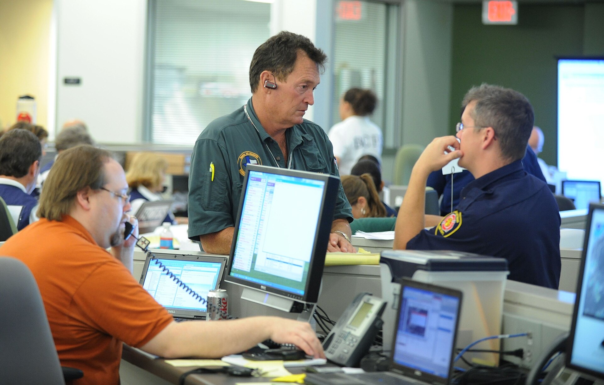 Emergency operations center staff coordinating during an exercise